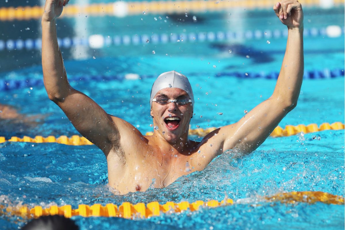 Celebrating swimmer in pool